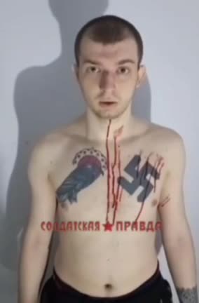A captive Ukrainian neo-Nazi in all his tattooed glory