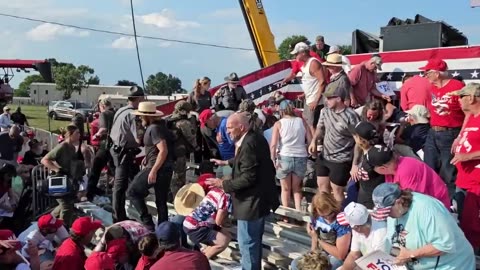 Bloodied Person Carried Away From Stands Following Shooting at Trump Rally