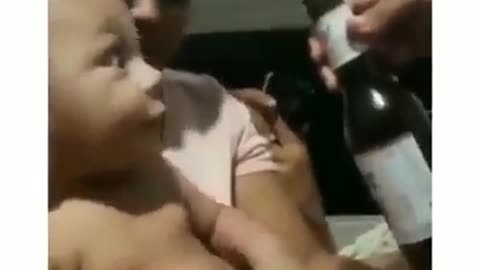 Try not to laugh challenge giving beer to baby see his reaction.