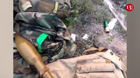 Ukrainian fighters hiding on hills open fire at the advancing Russians on the river bank