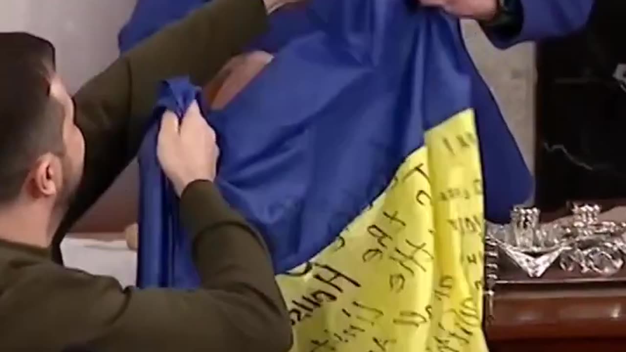 Ukrainian President Zelenskyy gifts a Ukrainian flag to the U.S. after addressing Congress