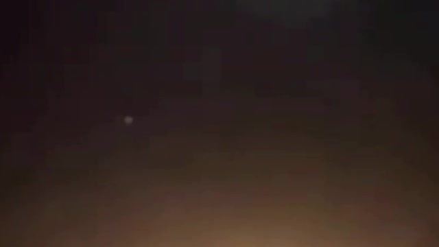 Missiles At Night Through The Clouds