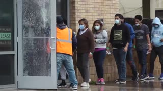 Video shows migrants being released at a parking garage in Brownsville, before being dropped off by taxi cabs to get on flights around U.S.