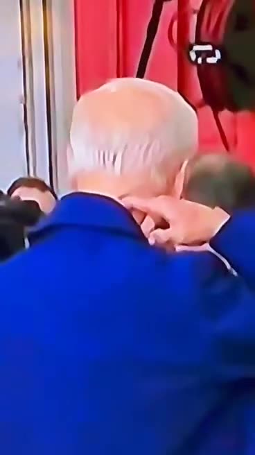 Biden in Ireland - Watch as he adjusts his rubber mask.