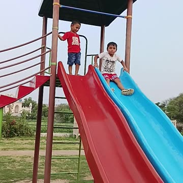 Indian park#small#children#playing#sliding
