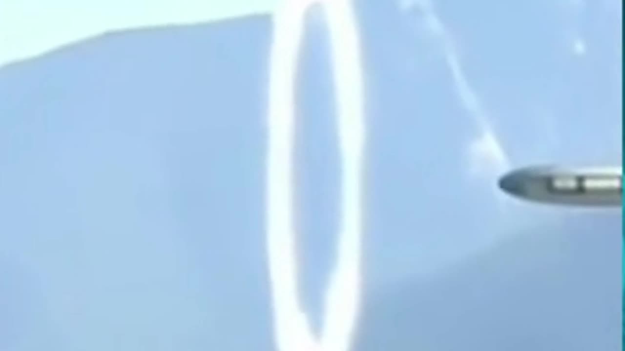 The UFO enters a portal which opens suddenly.