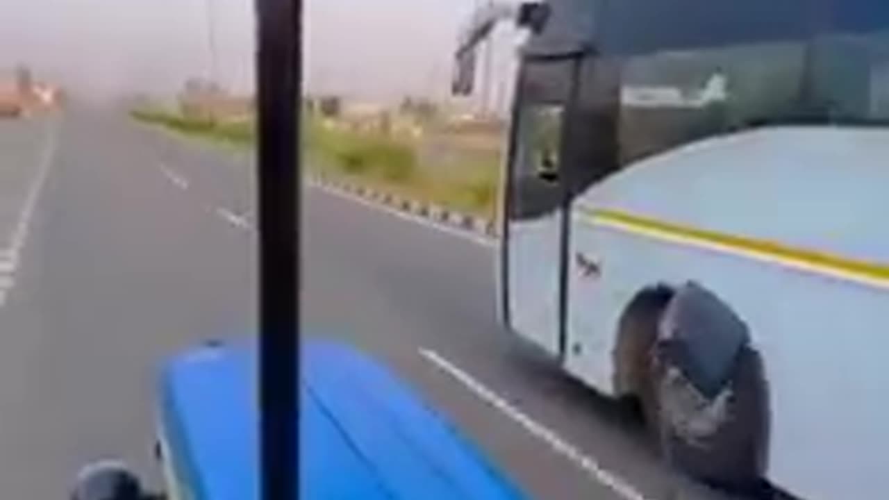 Tractor race to bus on the road