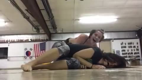 Girl Falls on Friend During Yoga Stretch