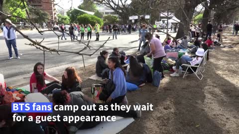 BTS fans camp out to see superstar Jin perform with Coldplay | AFP