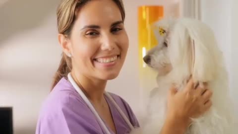 Portrait Of Happy Vet Smiling At Camera With Dog🐕