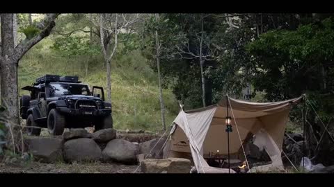Self driving outdoor camping, enjoying the beauty of the summer forest. Loneliness is the norm of li