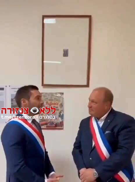 When being compelled to hang a picture of France's hated President Macron