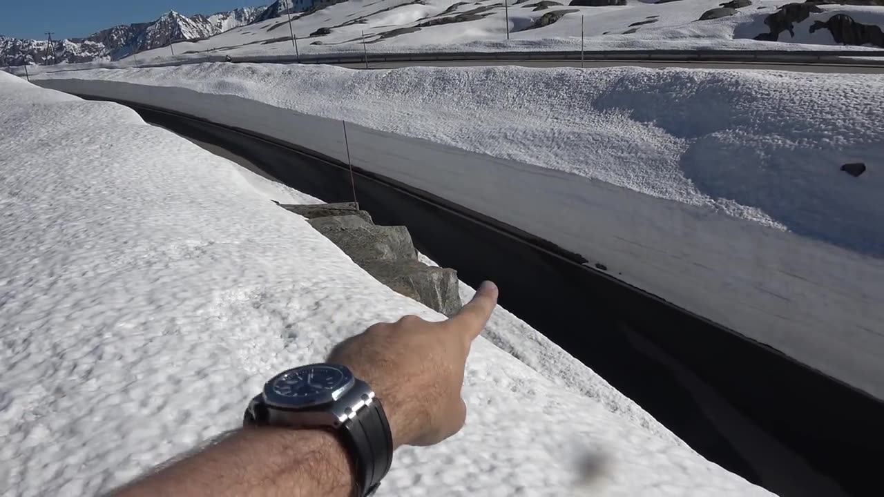 A McLaren F1 being driven in the snow