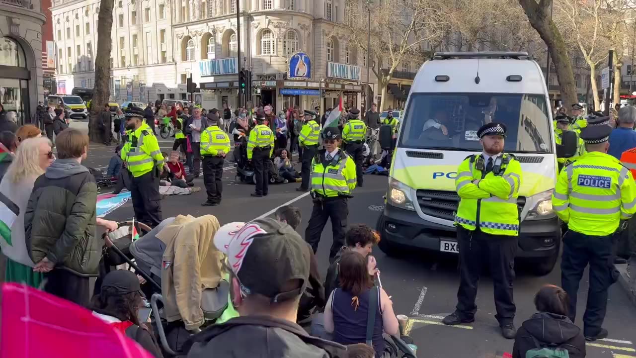 Mob rule Protestors surround police van preventing it leaving with individual arrested