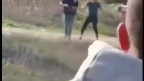 Palestinians hurling stones at Hamas terrorists controlling the aid