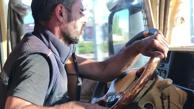 Truck driver with one person, one car and one world