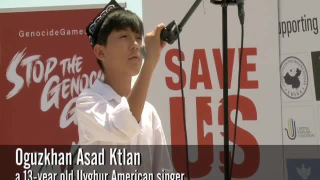 Oguzkhan Asad Ktlan sings at "Stop the Genocide Games" rally in DC