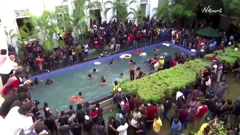 Sri Lankans storming president's palace and enjoy time in the pool