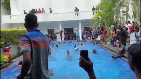 After the socialist president fled.. Sri lankans are enjoying the presidential swimming pool..