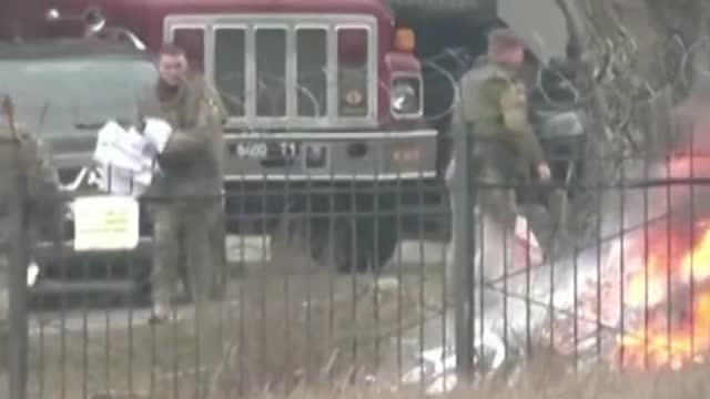 burning documents outside the Ukrainian defense ministry intelligence headquarters