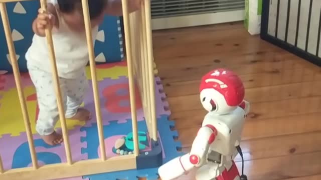 10 month old baby dancing with the robot