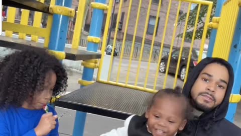 POLYGOD WITH POLYGODDESS PLAYING WITH HIS ALLEGED SON ON THE PLAYGROUND