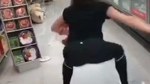 Girl in black tights at store dances and falls down