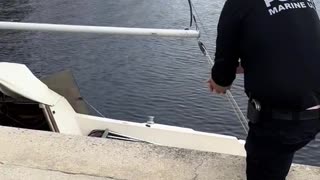 Earlier police tried to get boater who's riding it out through the hurricane to leave.