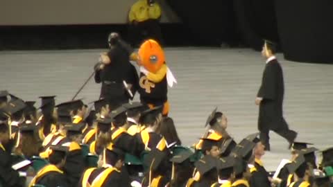 College Grad Tries To Ride Mascot Across Stage, Both Fall Hard