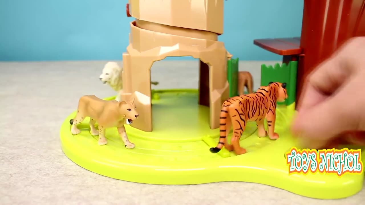 Elephants and Zebras Fight Over a Place to Drink in the Water Pool Under the Tree House