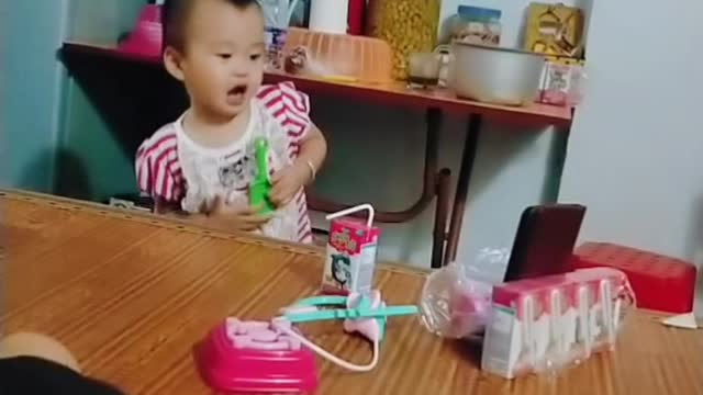 The baby learns to sing very cute