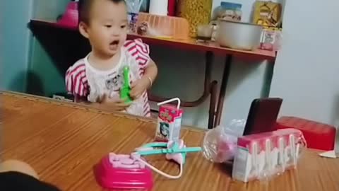 The baby learns to sing very cute