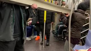 Pt. 2 guy carries gray metal beam inside subway train