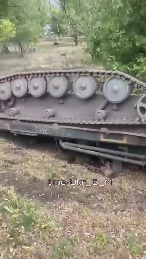 Ukrainian military engineering vehicle driving onto heavy-duty carrier falls off & ends upside down