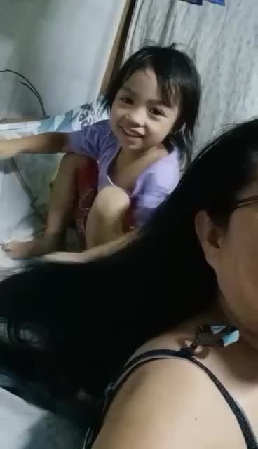 Little Jehia ministering to my wife's hair ❣️