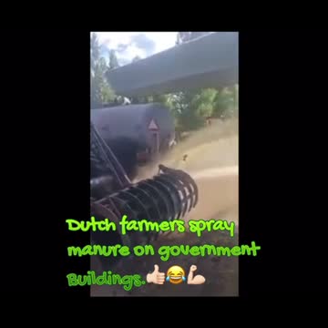 Dutch farmers spray manure on government buildings.