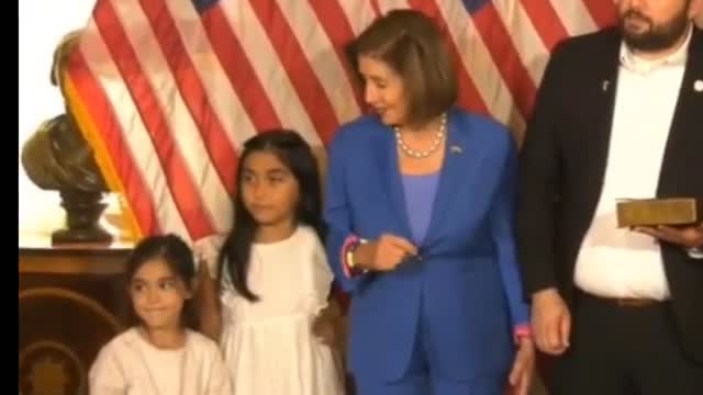 Pelosi, Queen of the Swamp Scum ...Pushing Rep. Flores daughter during photo op