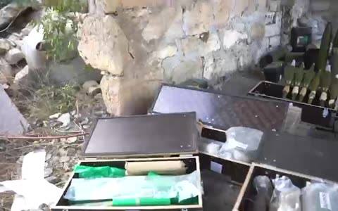 Attached is footage of a weapons stockpile located in a civilian residential