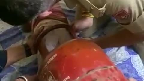 Gas cylinder trapped baby