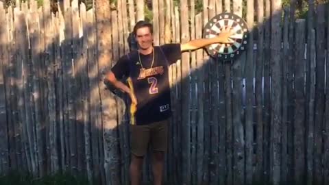 Helena dartboard barely misses hand
