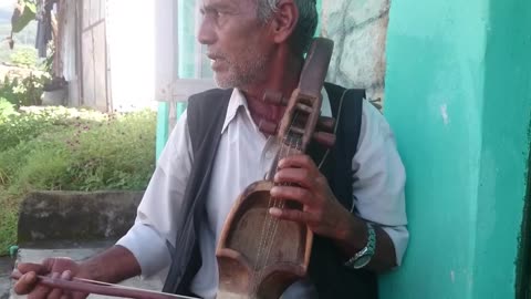 Mr. Parsuram Gandarbha from Nepal playing a Saarangi and singing folk Nepali song.