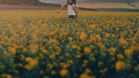 A Man Carrying A Woman