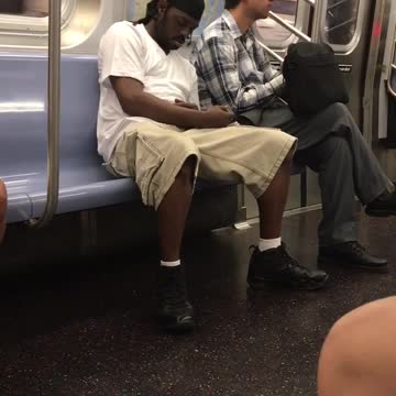 Guy white shirt khaki shorts falling asleep of grey plaid guy subway
