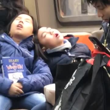 Man and woman asleep on each other