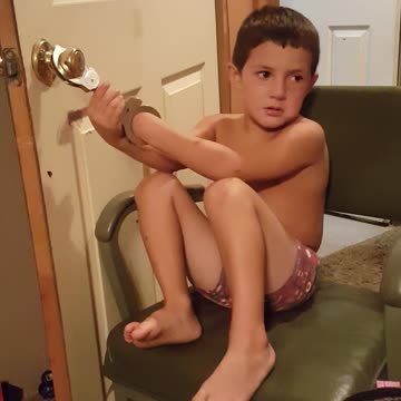 Boy Handcuffs Himself To Door, Can't Get Out