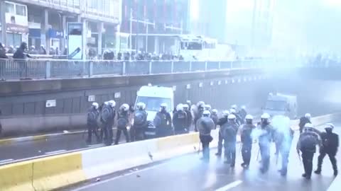 Riot police use water cannons to disperse anti-COVID restrictions protesters in Brussels