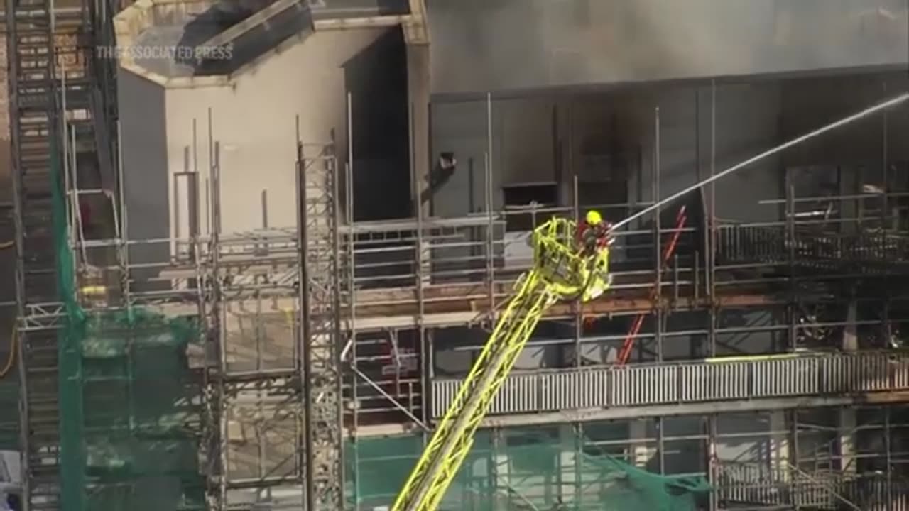 Fire engulfs apartment building in east London