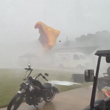 Strong thunderstorm winds destroy outdoor tents in Hillsboro, Alabama