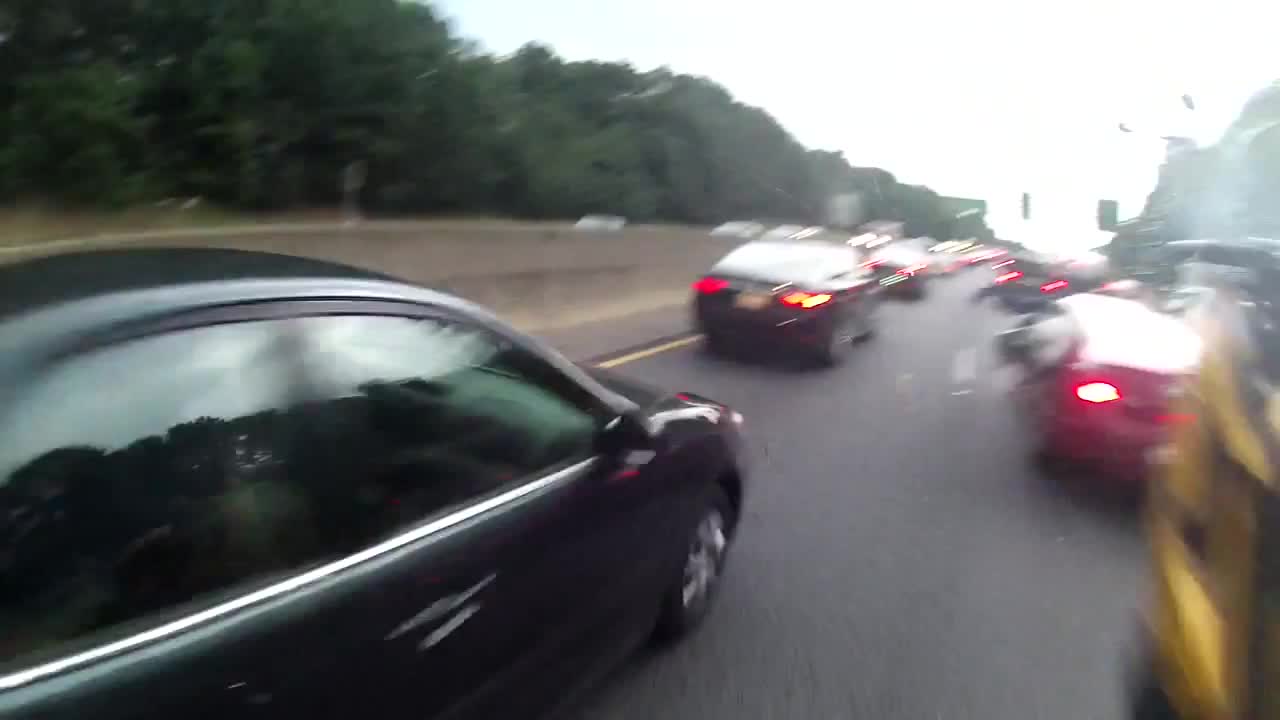 POV Footage Shows Reckless Motorcyclist Crash While Splitting Lanes