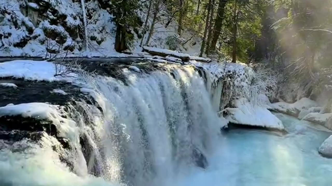 Waterfall winter mountains